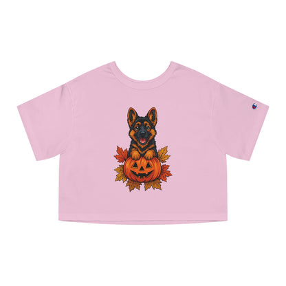 Pink crop top with a Halloween-themed graphic of a dog and pumpkin on a white background