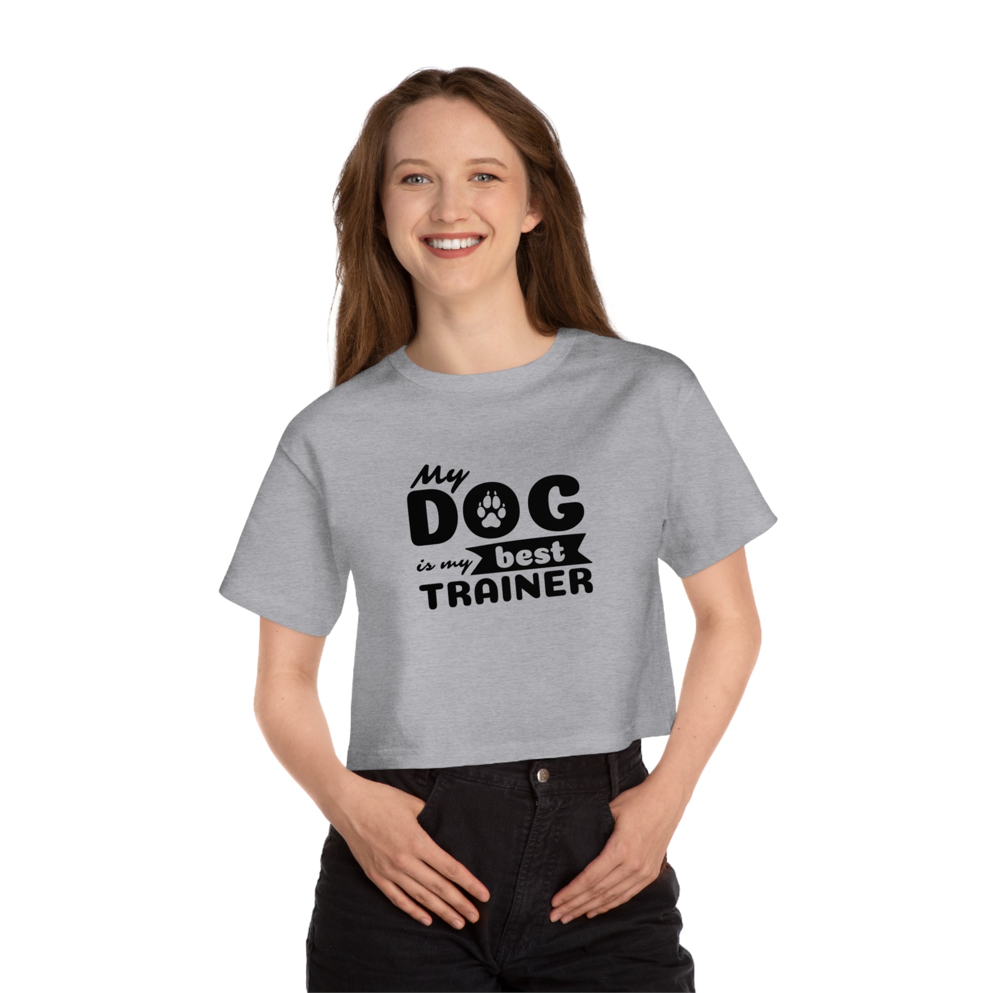 Person wearing a gray t-shirt with 'My dog is my best trainer' text on a white background