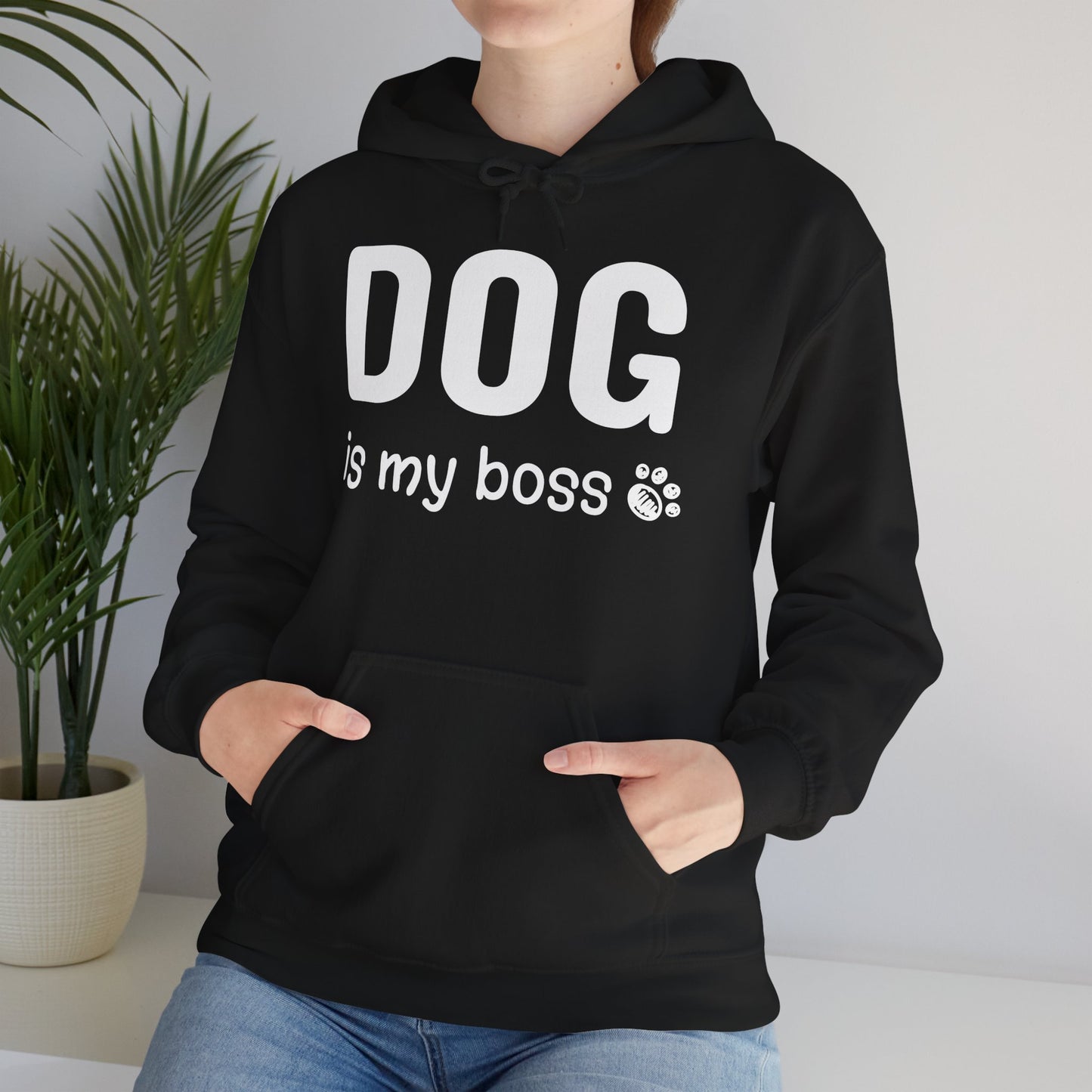 Person wearing a black hoodie with 'DOG is my boss' text