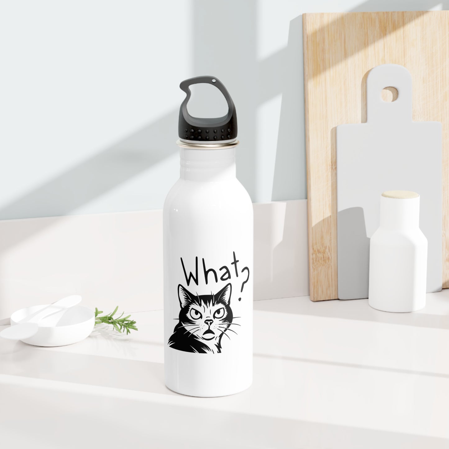 White water bottle with a black cat illustration and 'What?' text on a white surface.