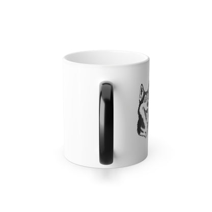 White mug with black handle and a small black and white design on a white background