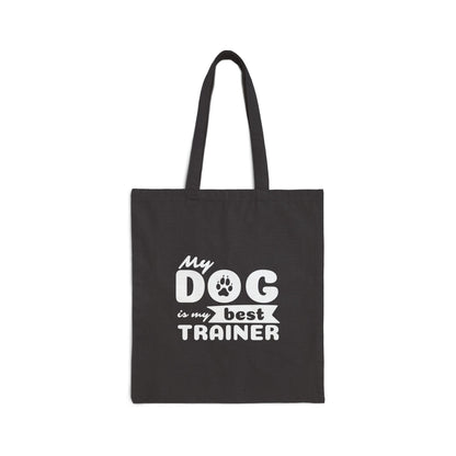 Black tote bag with 'My dog is my best trainer' text on a white background