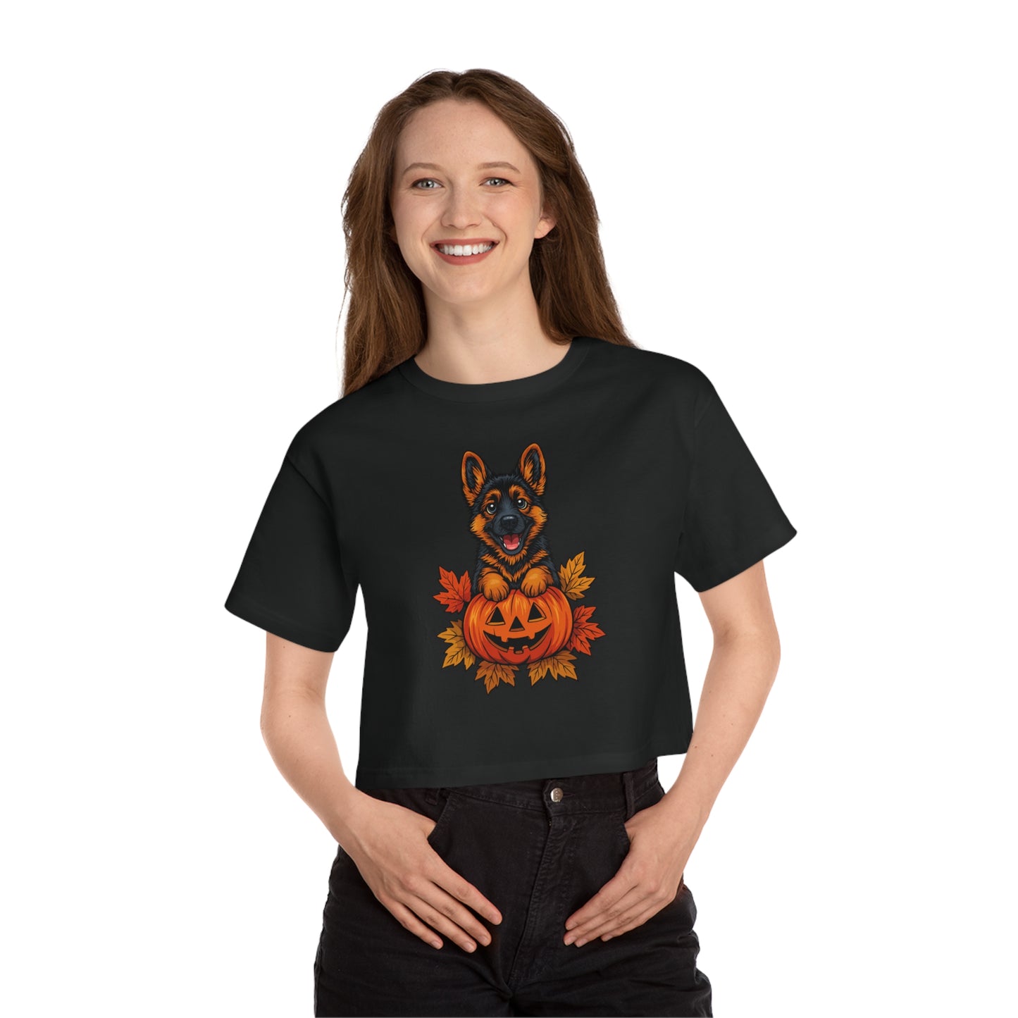 Person wearing a black t-shirt with a Halloween-themed design featuring a dog and pumpkin.