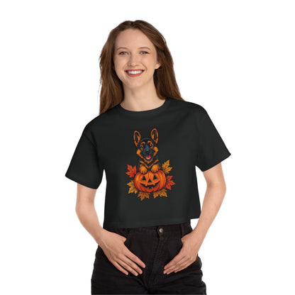 Person wearing a black t-shirt with a Halloween-themed design featuring a dog and pumpkin.