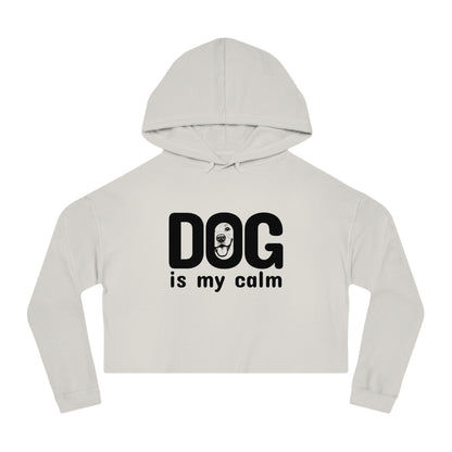White cropped hoodie with 'DOG is my calm' text on a white background