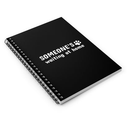 Black notebook with 'SOMEONE'S waiting at home' text and paw print on a white background