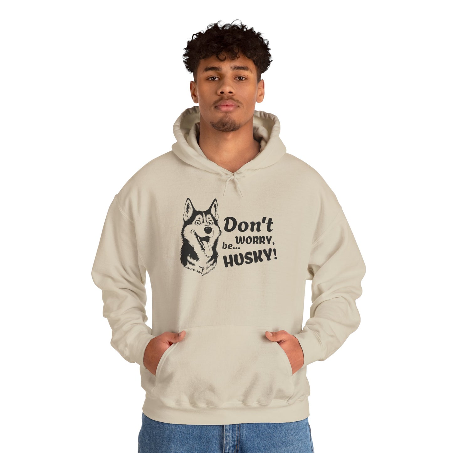 Person wearing a beige hoodie with a husky graphic and text on a white background