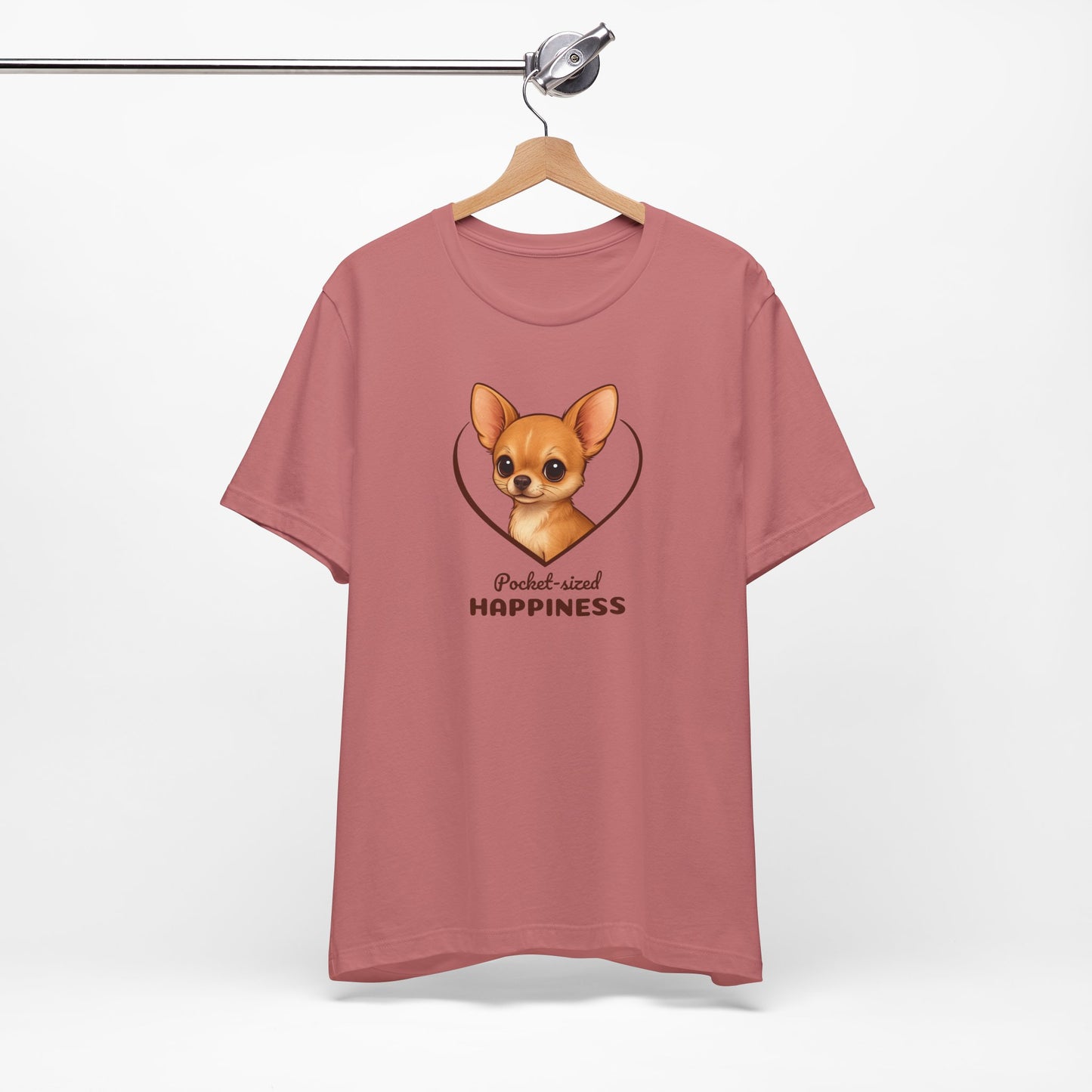 Pink t-shirt with a dog graphic and text on a white background