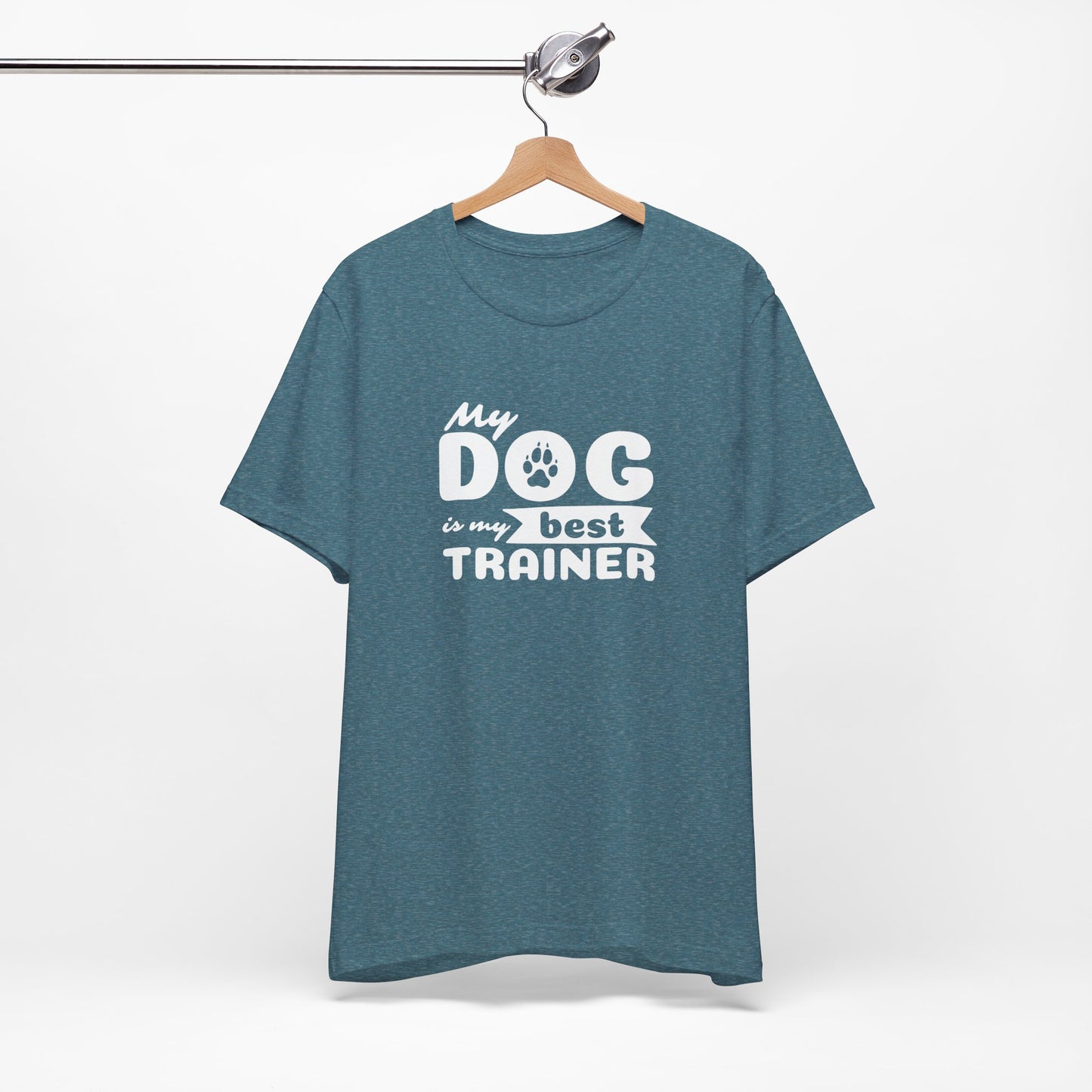 Blue t-shirt with 'My dog is my best trainer' text on a hanger against a white background