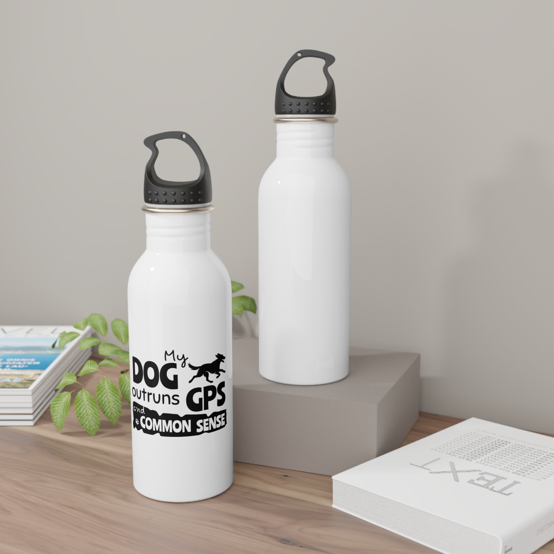 Two white water bottles with black text and design on a wooden surface.