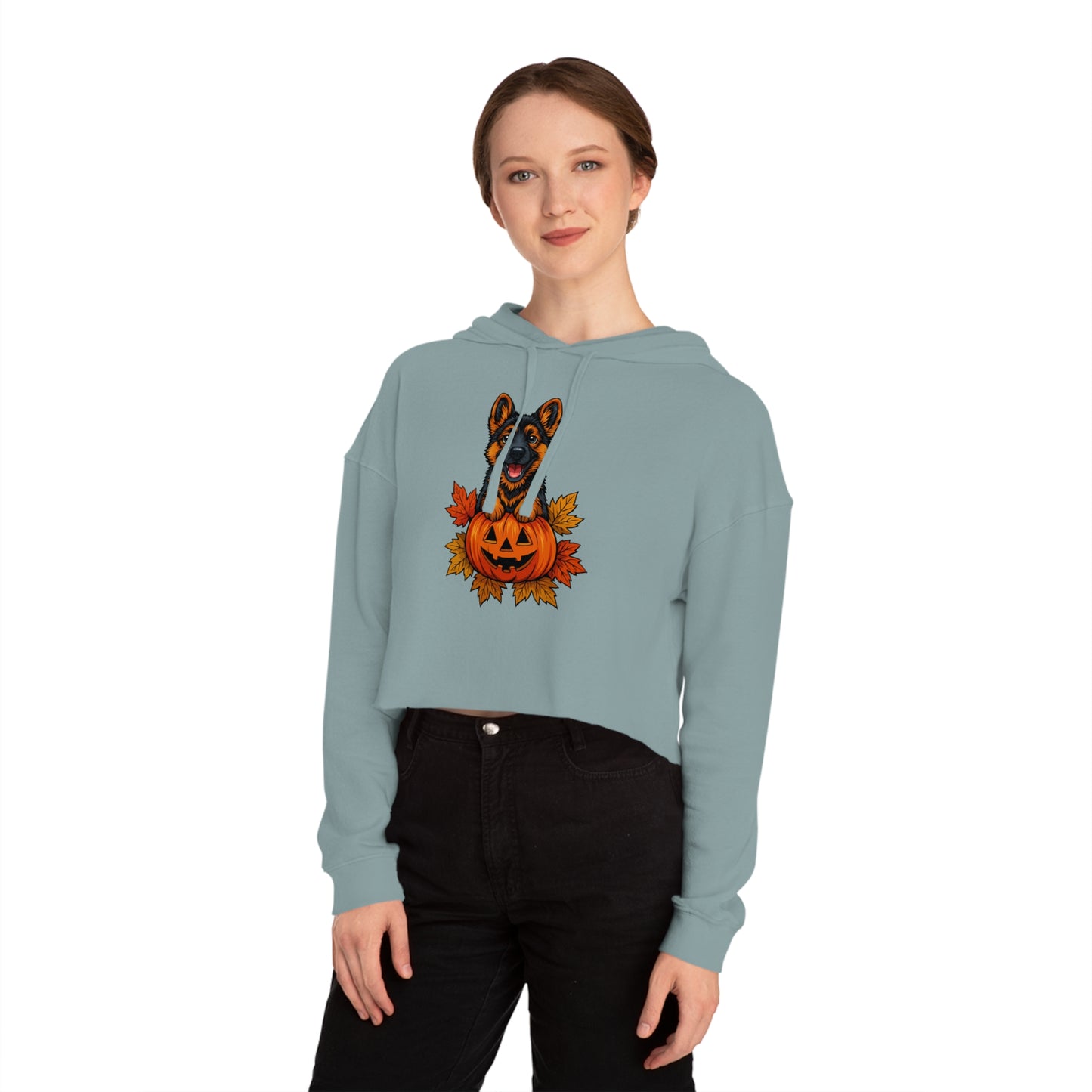 Woman wearing a light blue hoodie with a Halloween-themed design on a white background