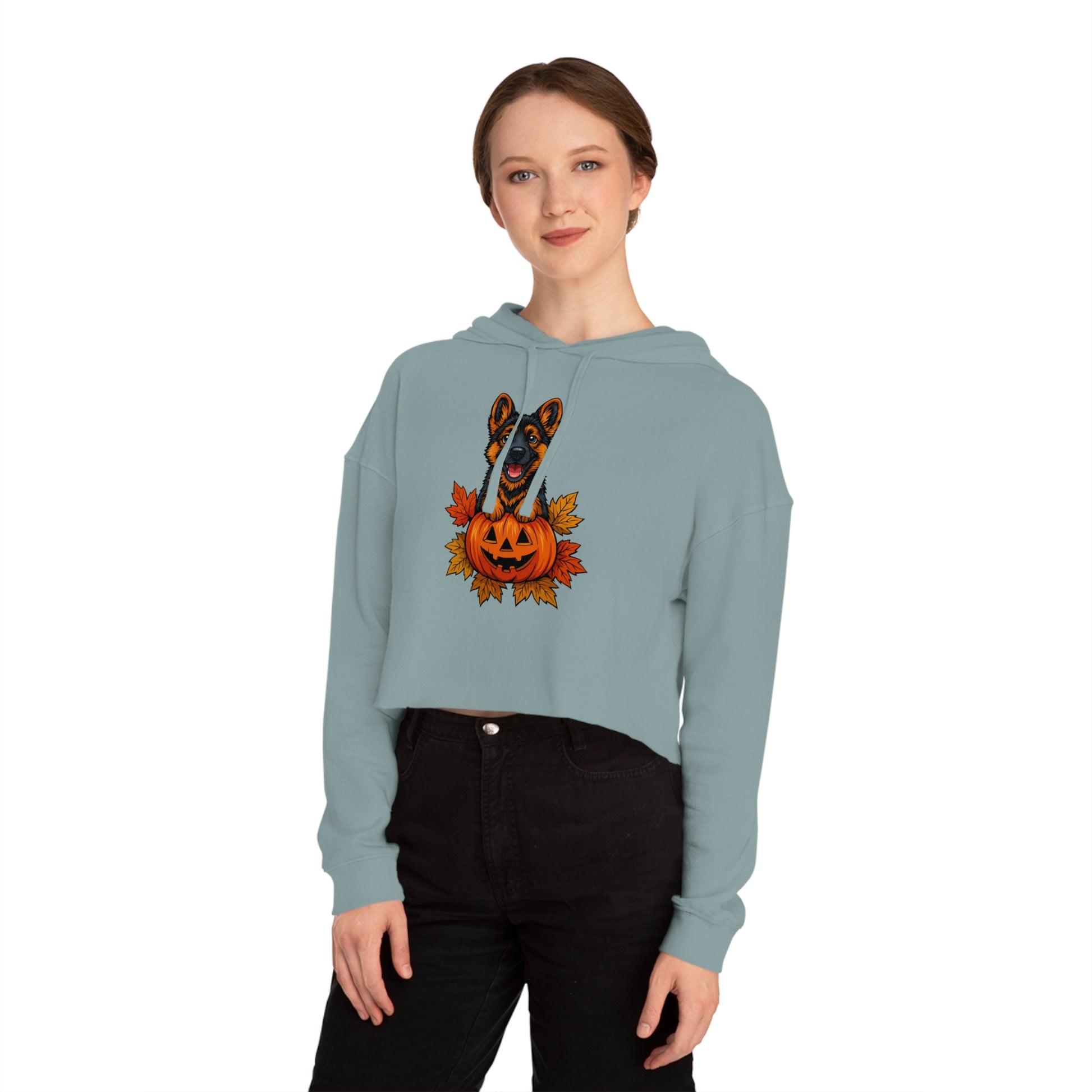Woman wearing a light blue hoodie with a Halloween-themed design on a white background