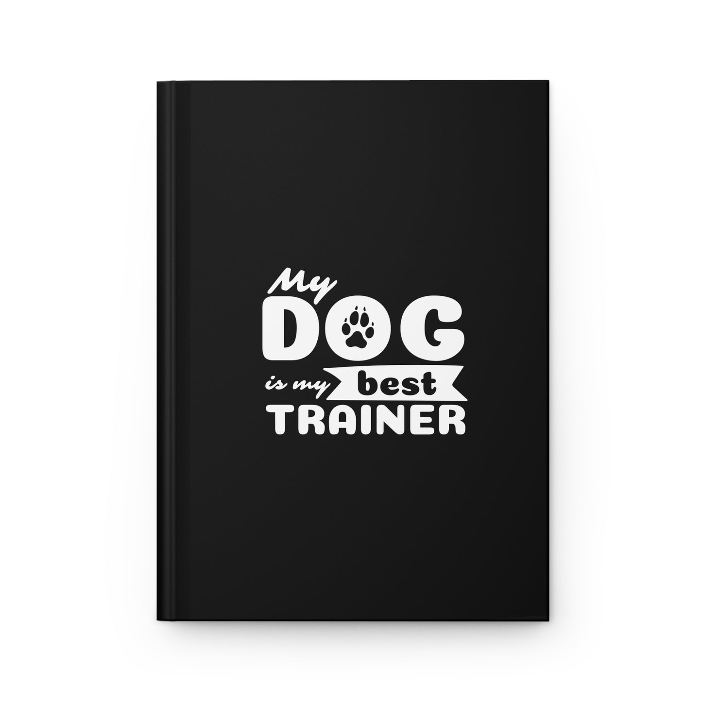 Black notebook with 'My dog is my best trainer' text on a white background