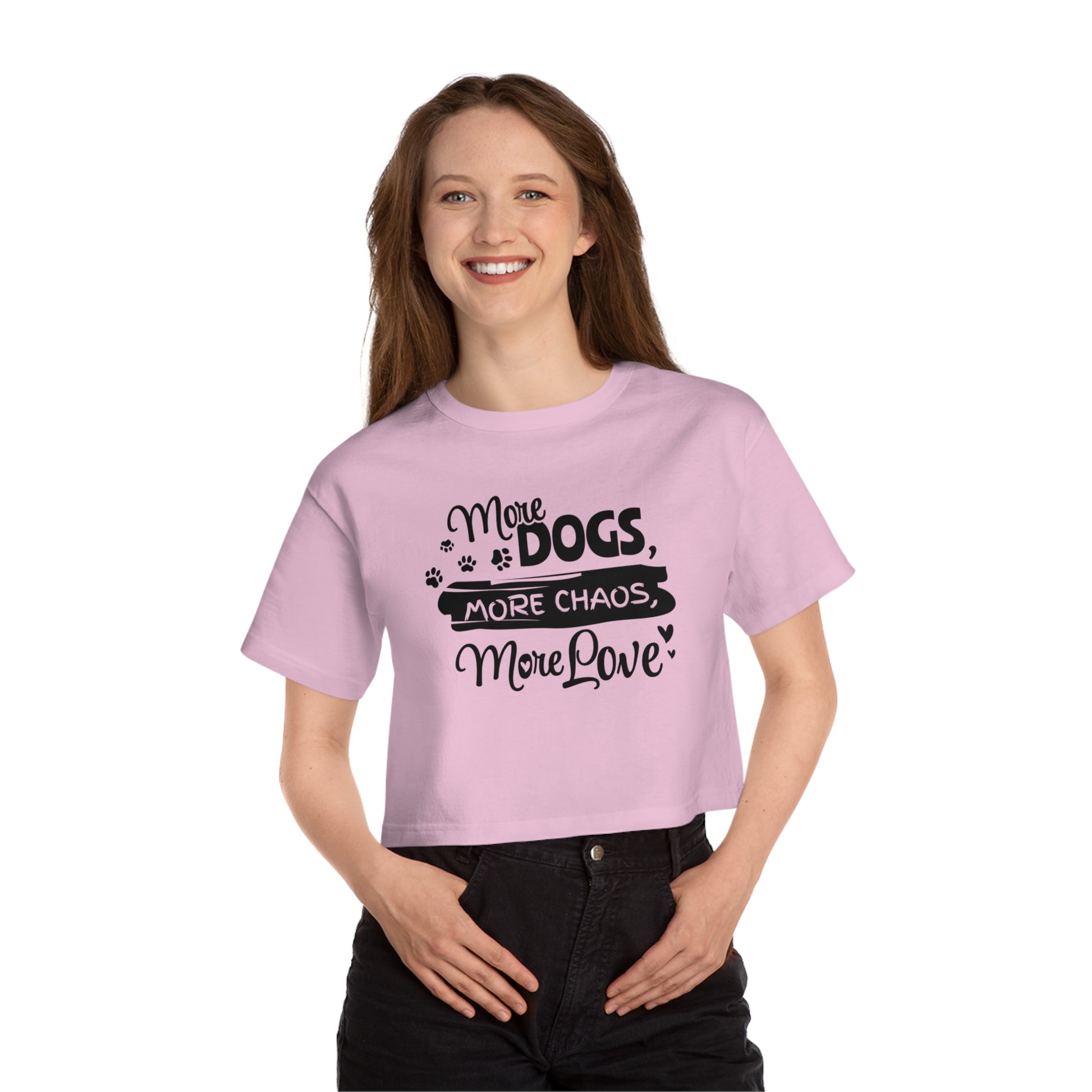 Person wearing a pink t-shirt with text and paw prints on a white background