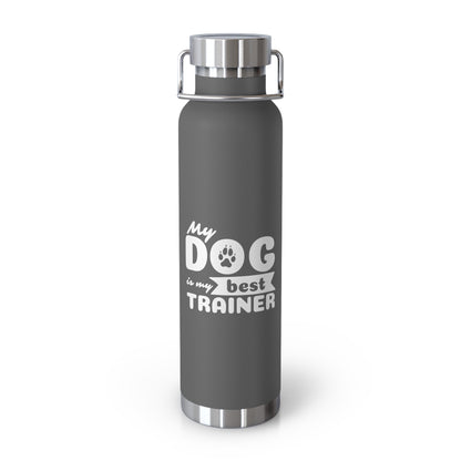 Gray water bottle with 'My dog is my best trainer' text on a white background
