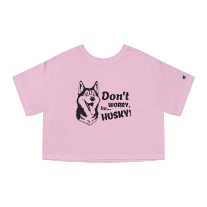 Pink crop top with husky graphic and text on a white background