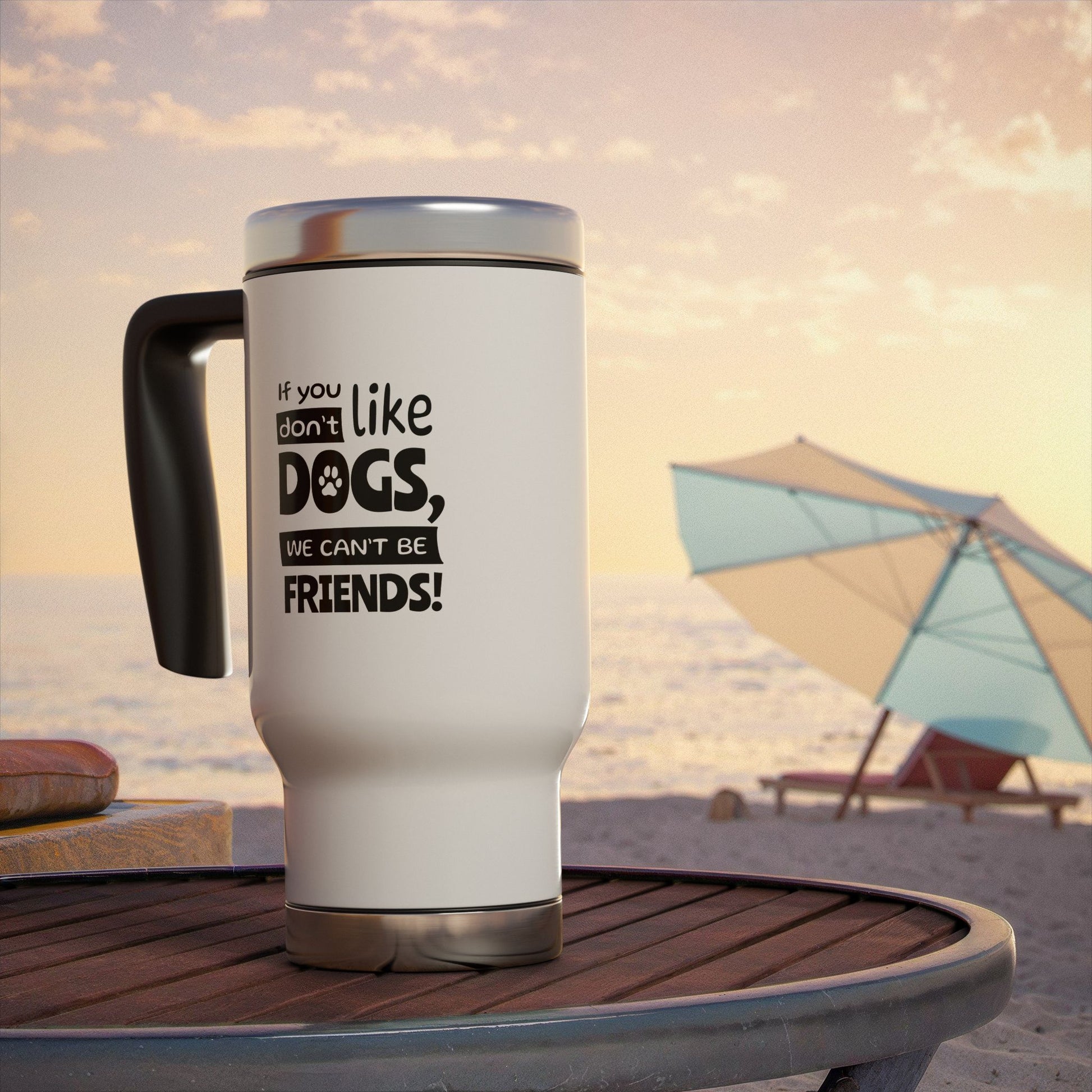 White travel mug with a humorous dog quote on a beach table with a sunset background