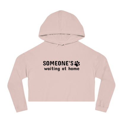 Pink cropped hoodie with text 'SOMEONE'S waiting at home' on a white background