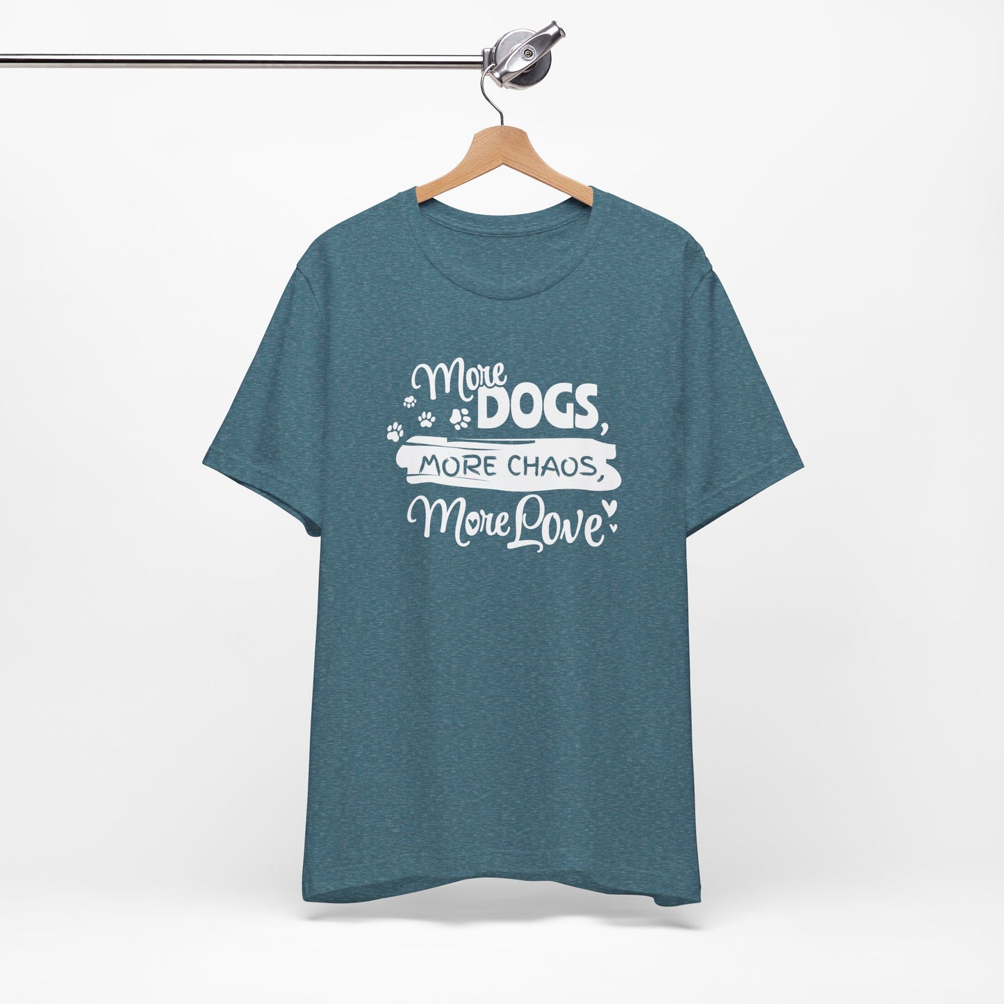 Blue t-shirt with white text 'More Dogs, More Chaos, More Love' on a hanger against a white background