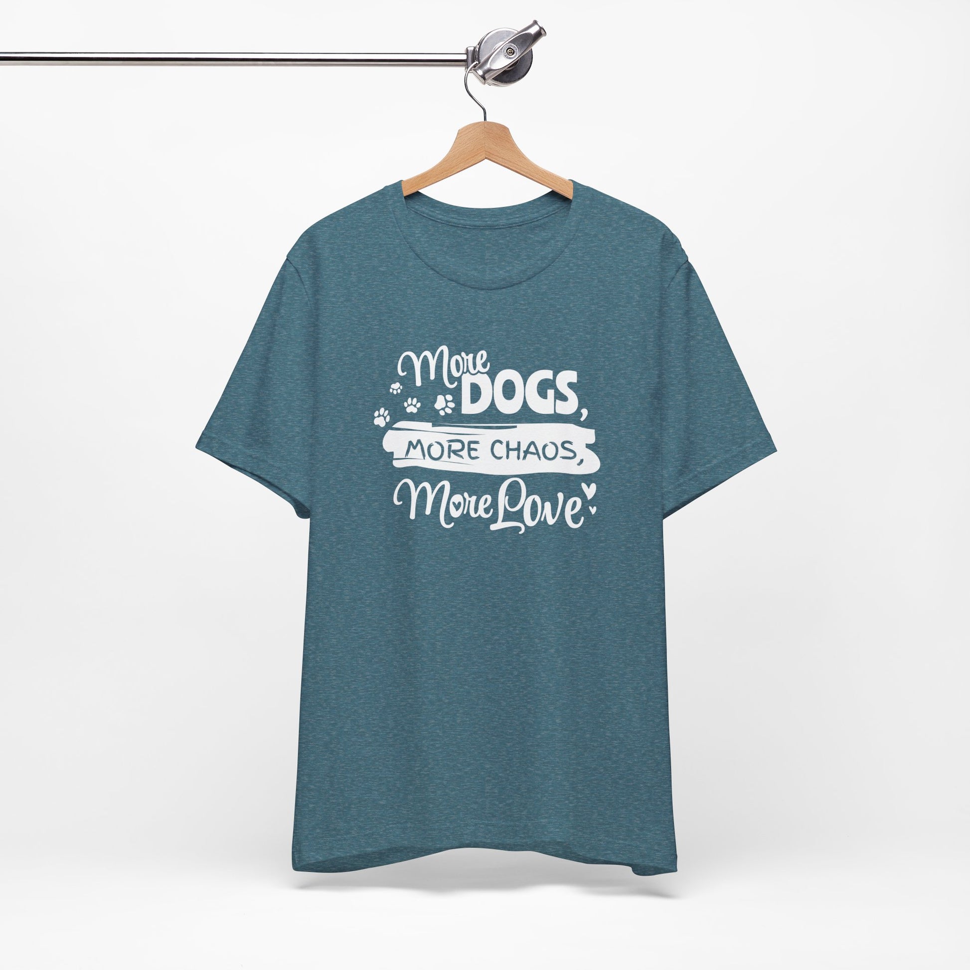 Blue t-shirt with white text 'More Dogs, More Chaos, More Love' on a hanger against a white background