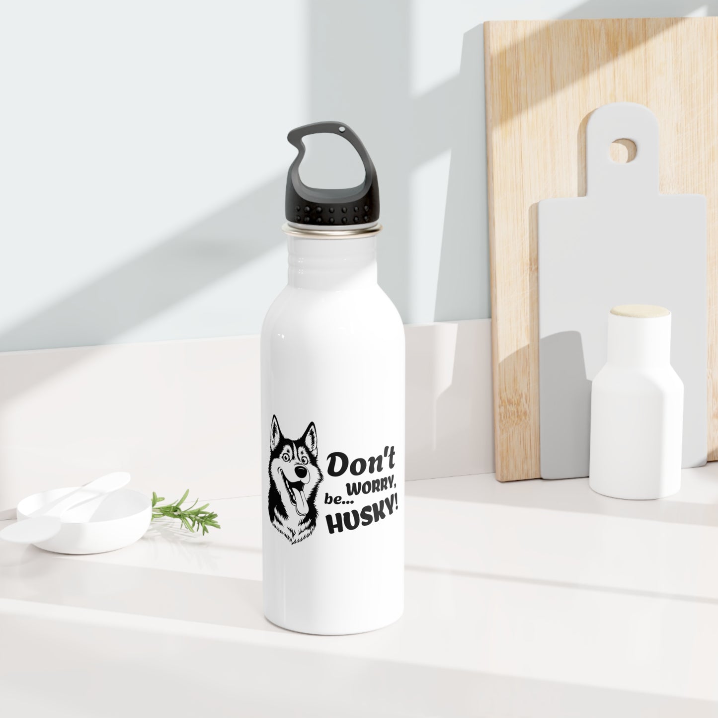 White water bottle with husky design and text on a white surface