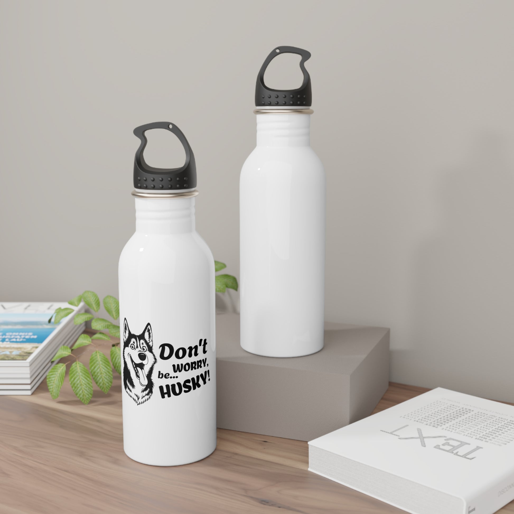 Two white water bottles with black lids on a wooden surface.