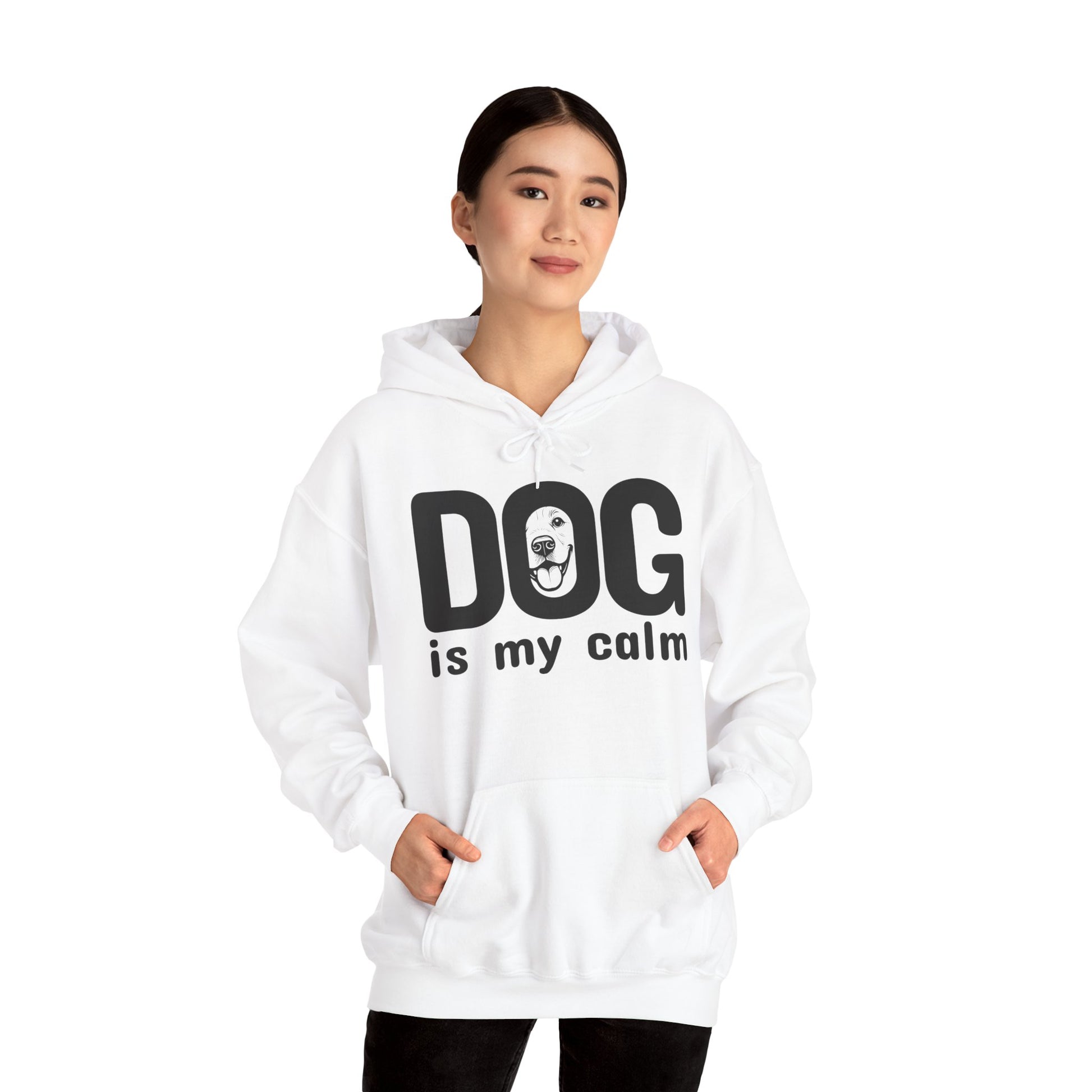 Person wearing a white hoodie with 'DOG is my calm' text on a white background
