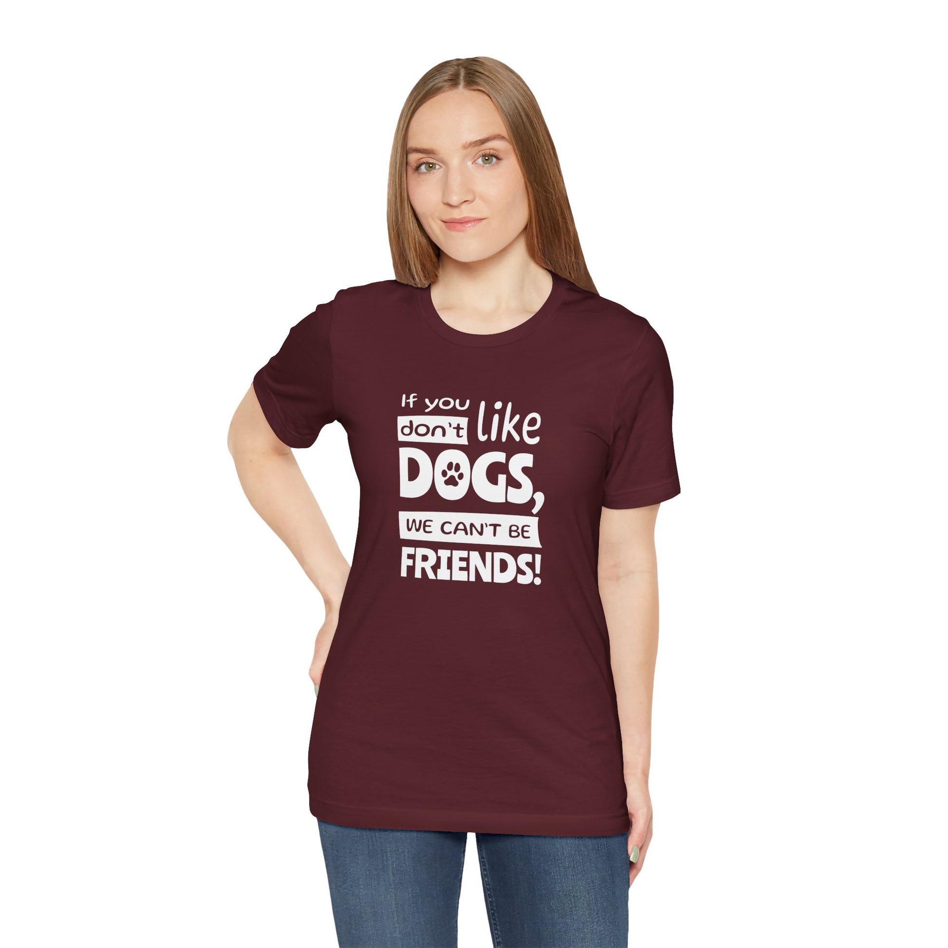 Person wearing a maroon t-shirt with a humorous dog-themed message on a white background
