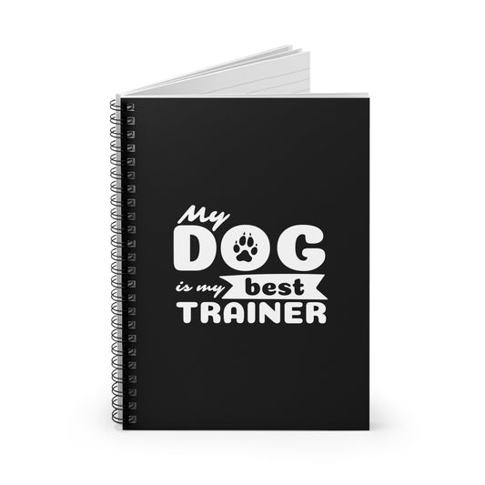 Black notebook with 'My dog is my best trainer' text on a white background