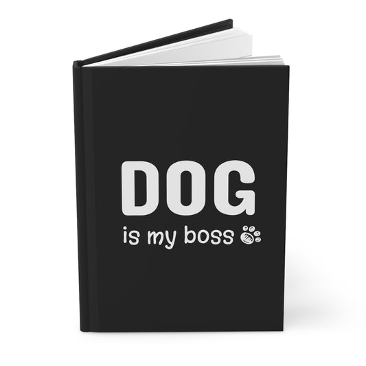 Black notebook with 'DOG is my boss' text on a white background