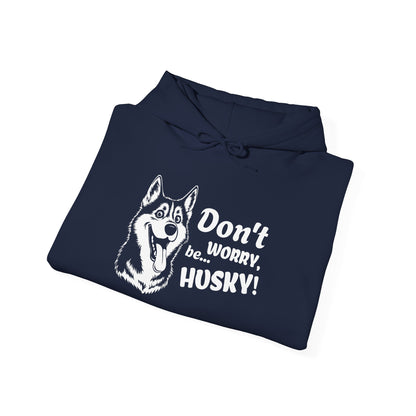 Folded navy blue hoodie with husky graphic and text on a white background
