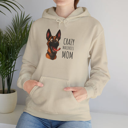 Person wearing a beige hoodie with a dog graphic and text, standing against a plain background.