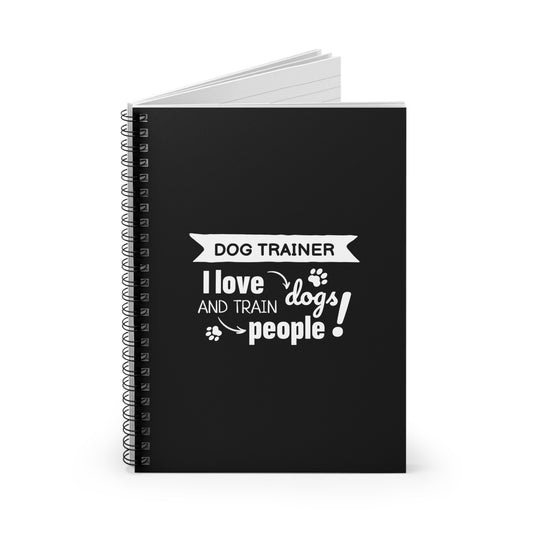 Black notebook with white text 'Dog Trainer I love and train dogs people!' on a white background