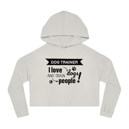 Light gray cropped hoodie with text 'Dog Trainer I love dogs and train people' on a white background