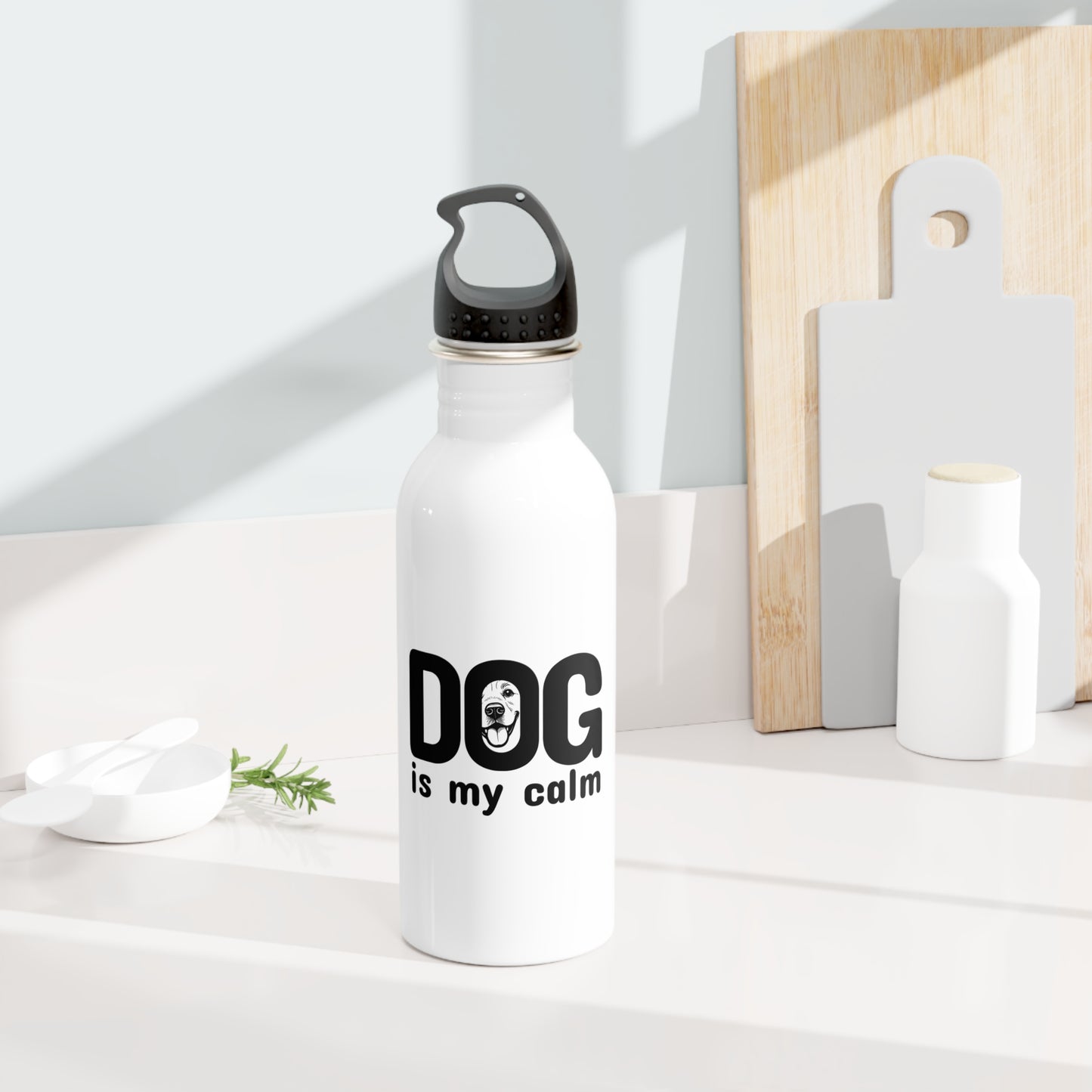 White water bottle with 'DOG is my calm' text on a light background