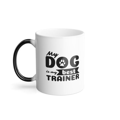 White mug with black text 'My dog is my best trainer' on a white background