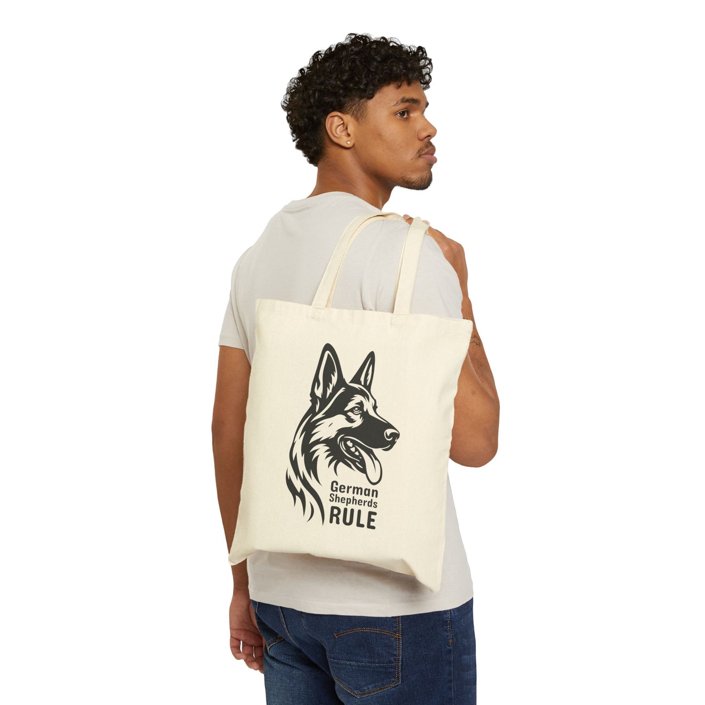 Man carrying a tote bag with a German Shepherd design and text.