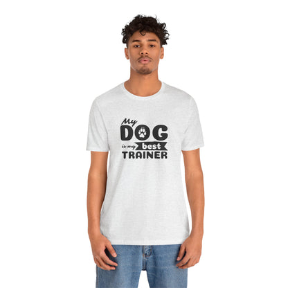 Person wearing a white t-shirt with 'My dog is my best trainer' text on a white background