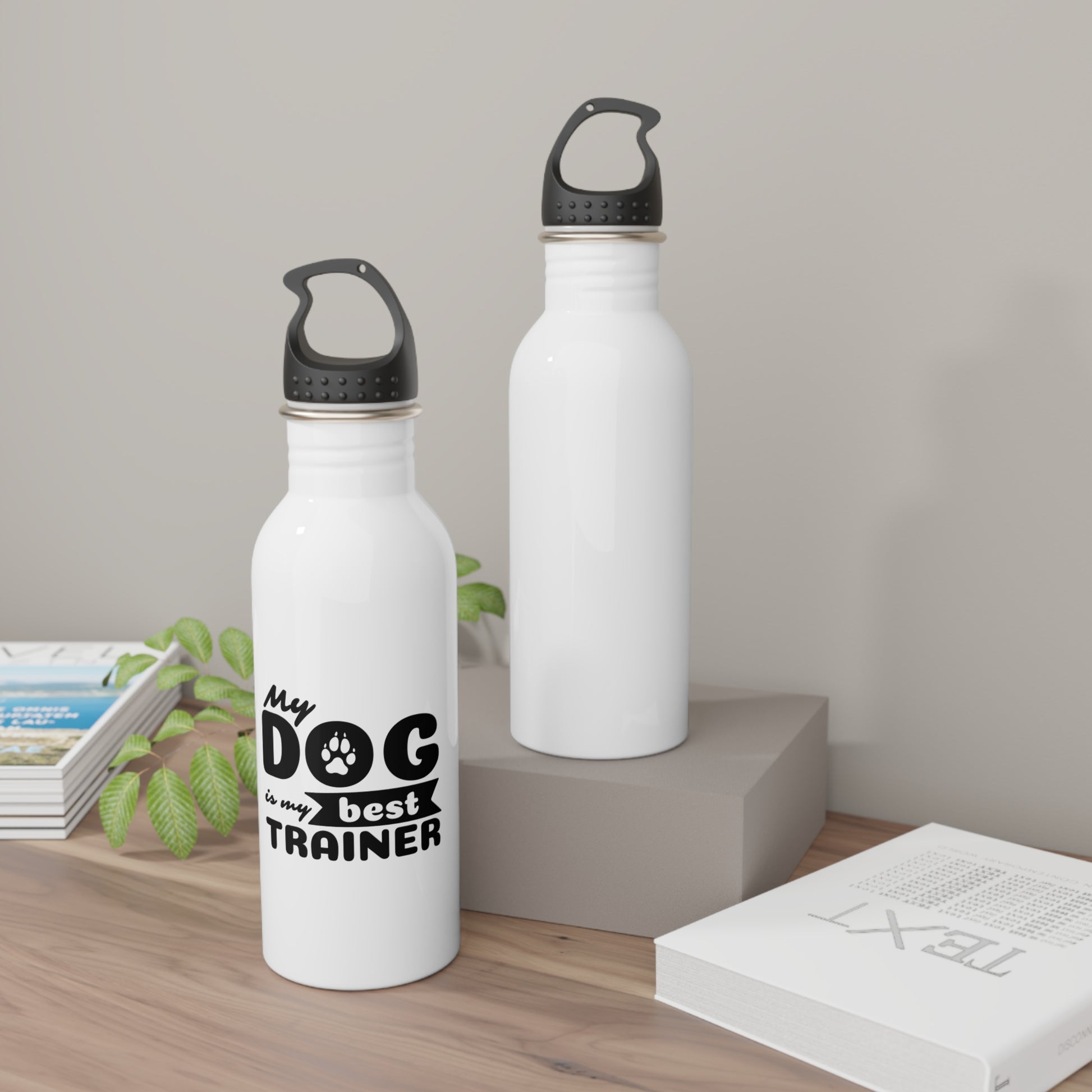 Two white water bottles with black text and accents on a wooden surface.