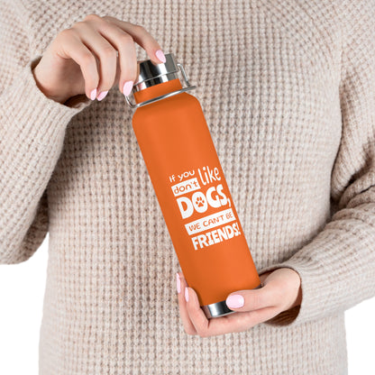 Person holding an orange water bottle with a humorous text design.