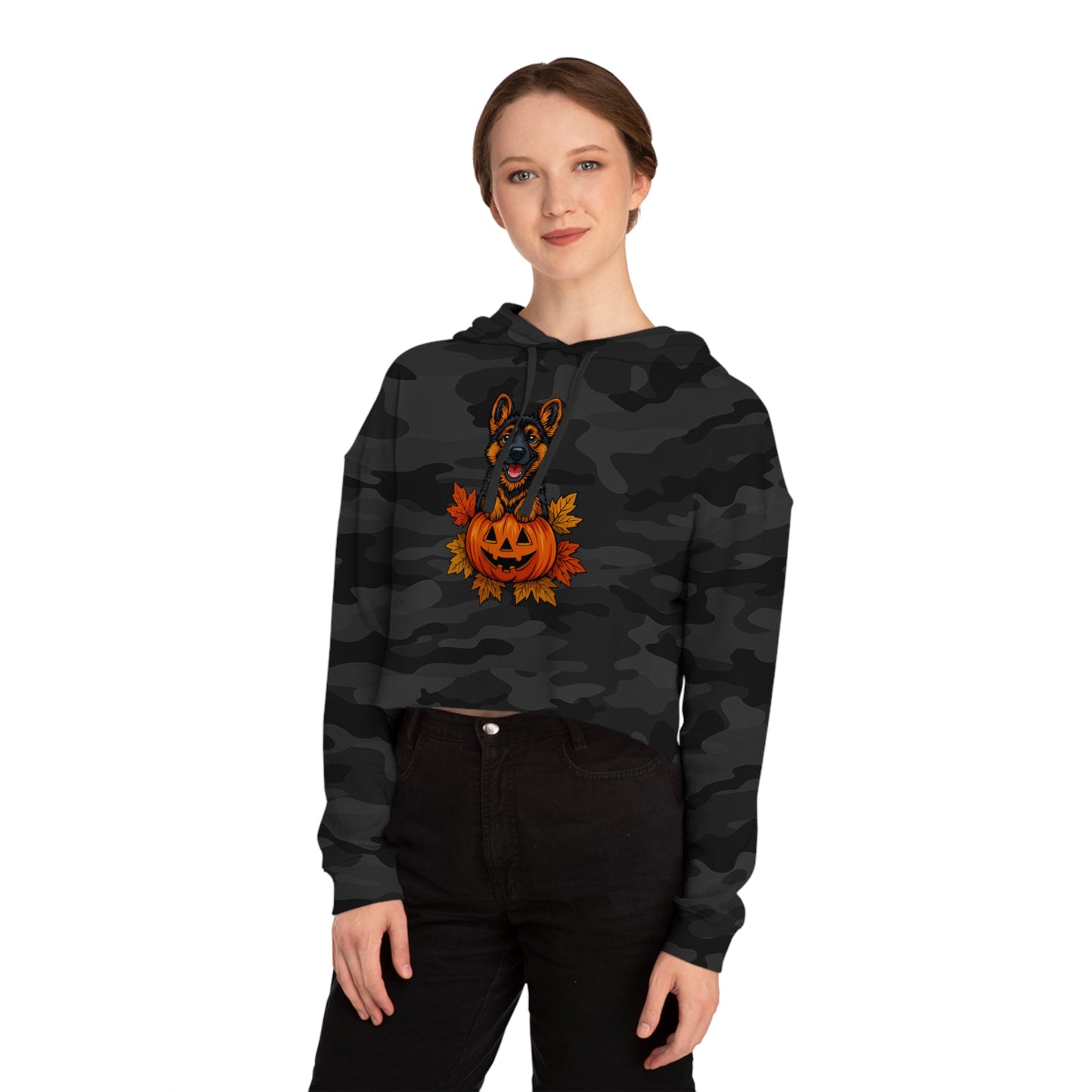 Person wearing a black camouflage hoodie with a Halloween design on a white background