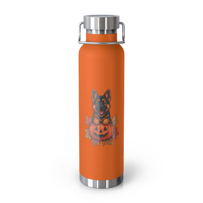 Orange water bottle with a dog and pumpkin design on a white background