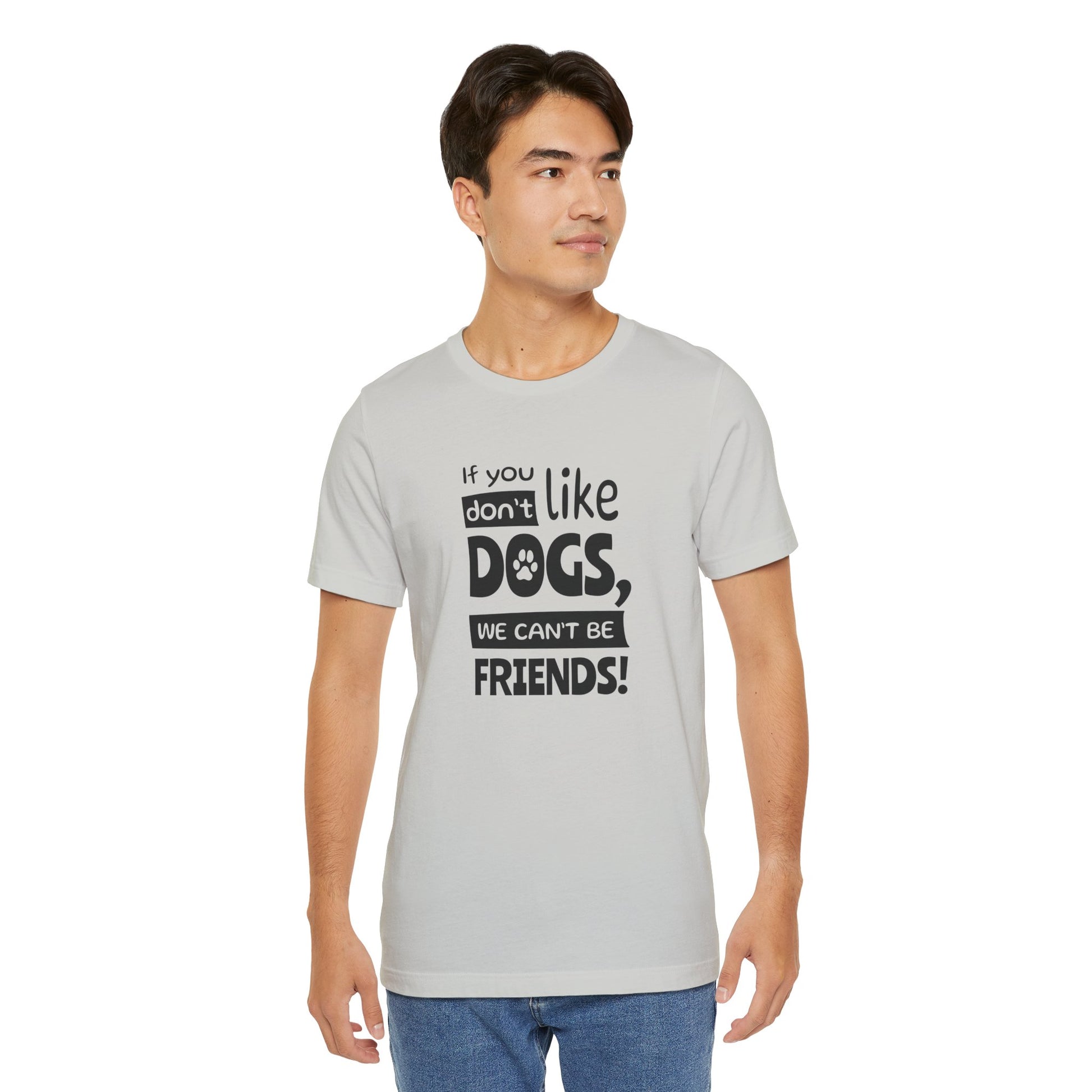 Man wearing a gray t-shirt with a humorous dog-themed message on a white background