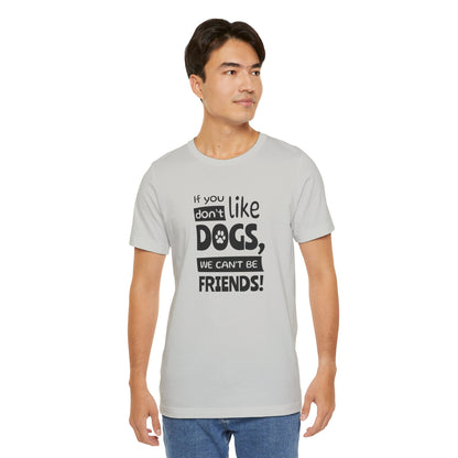 Man wearing a gray t-shirt with a humorous dog-themed message on a white background