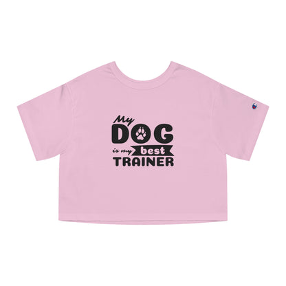 Pink crop top with 'My dog is my best trainer' text on a white background