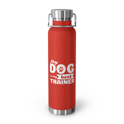 Red water bottle with 'My dog is my best trainer' text on a white background