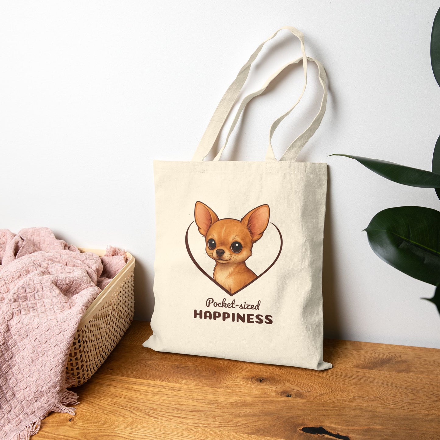 Tote bag with a dog illustration and text on a wooden surface with a white wall background