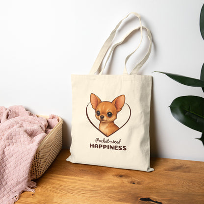Tote bag with a dog illustration and text on a wooden surface with a white wall background