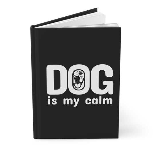 Black notebook with 'DOG is my calm' text on a white background