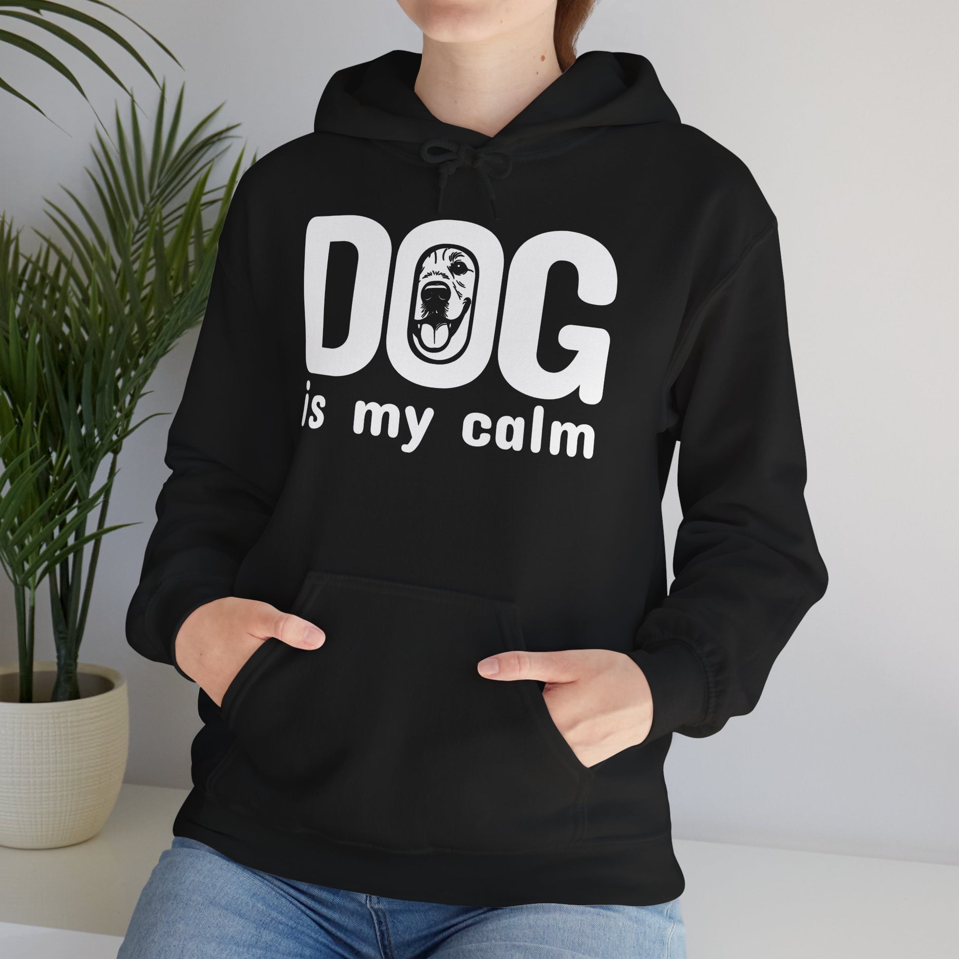 Person wearing a black hoodie with 'DOG is my calm' text and graphic.